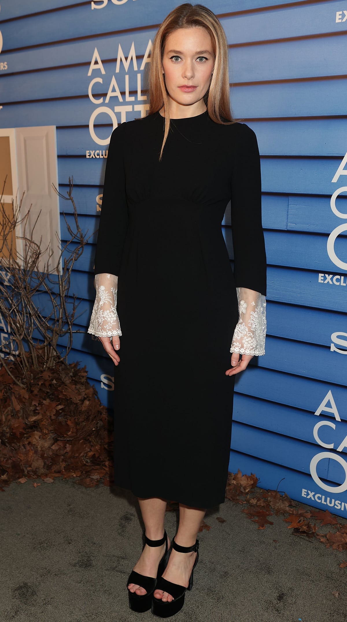 Rachel Keller, standing 5 feet 5 inches (165.1 cm) tall and wearing a US shoe size 8, exuded vintage charm in a black midi dress with sheer lace cuffs and bold black velvet platform heels at the A Man Called Otto premiere