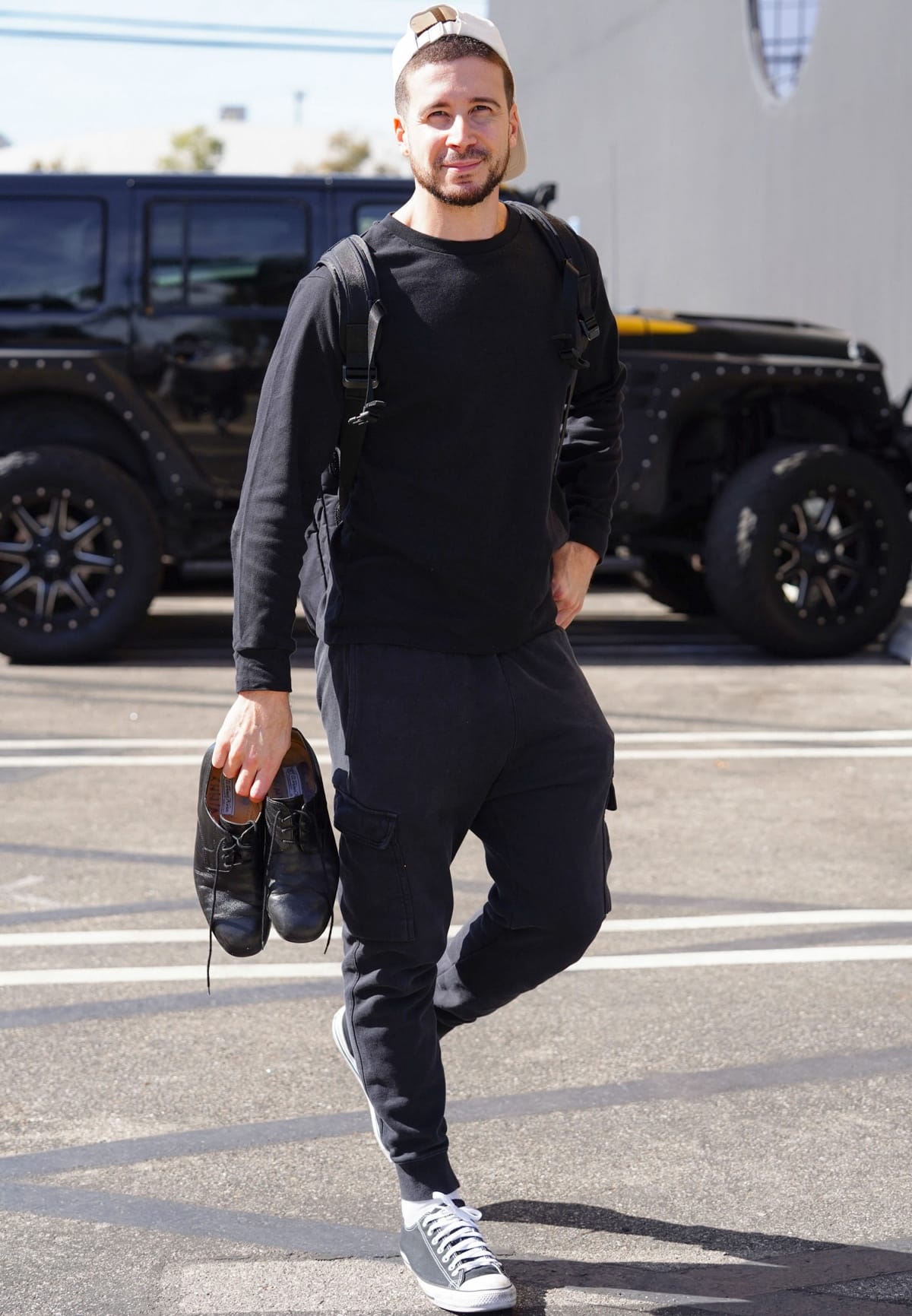 Vinny Guadagnino kept it sporty in black joggers, a matching sweatshirt, and classic black Converse Chuck Taylor sneakers while carrying his dance shoes