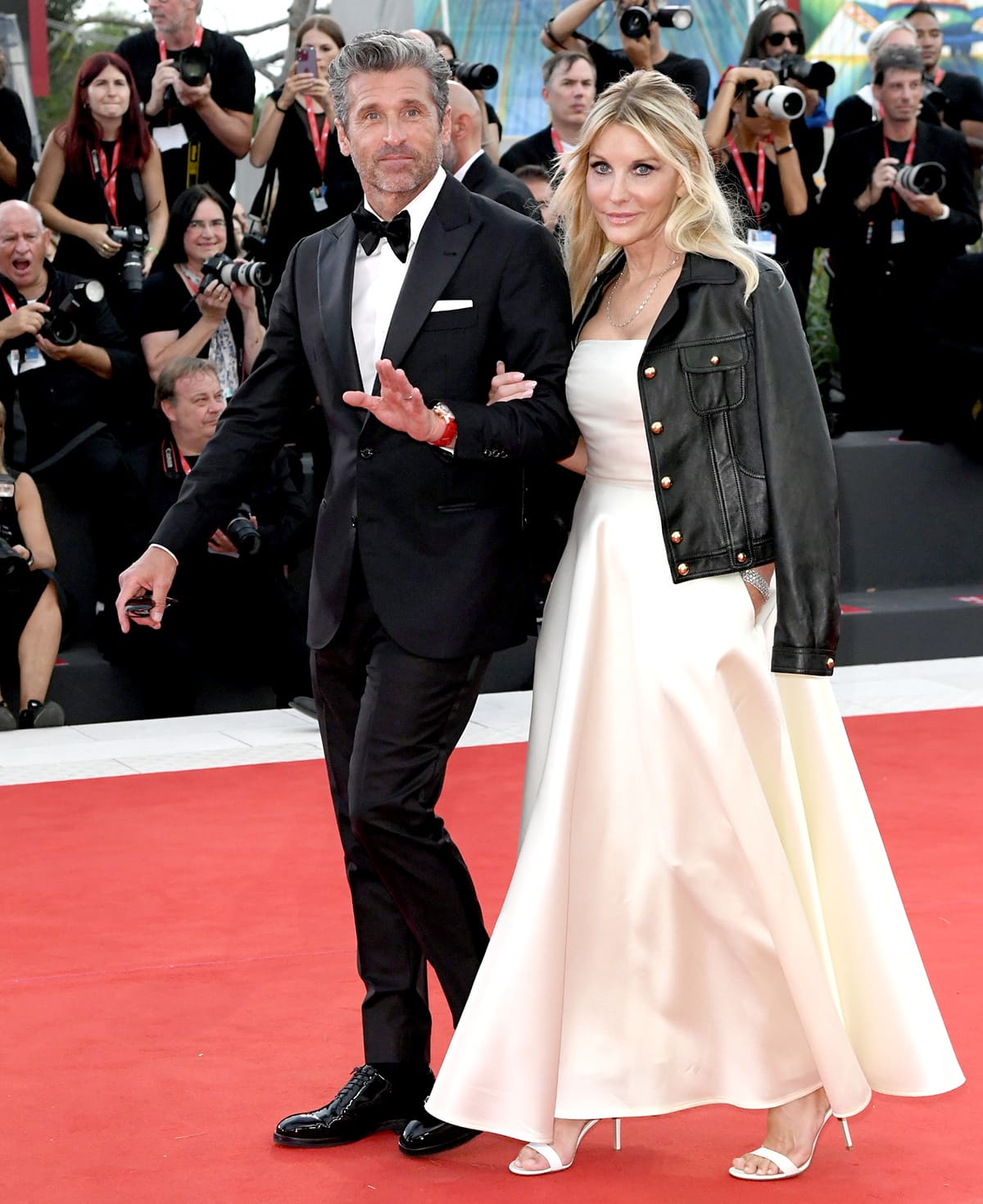 Jillian Fink exudes timeless elegance in a strapless ivory gown with white open-toe heels