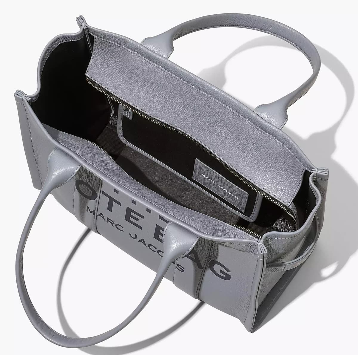 The lining of a genuine Marc Jacobs handbag should be made of high-quality materials, such as silk or leather