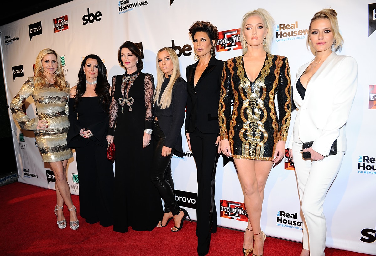 The Real Housewives of Beverly Hills cast dazzles at the Season 8 premiere party on December 16, 2017, showcasing everything from glittering platform heels and metallic mini dresses to sleek stilettos and sharply tailored suits