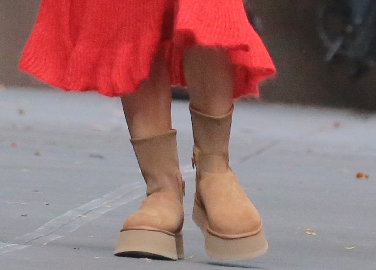 Emily Ratajkowski wearing a pair of Ugg classic dipper boots in a chic beige color