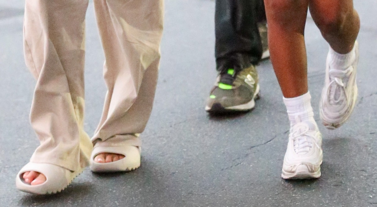 A closer look at Kim Kardashian’s Yeezy slides and Saint West’s Nike sneakers