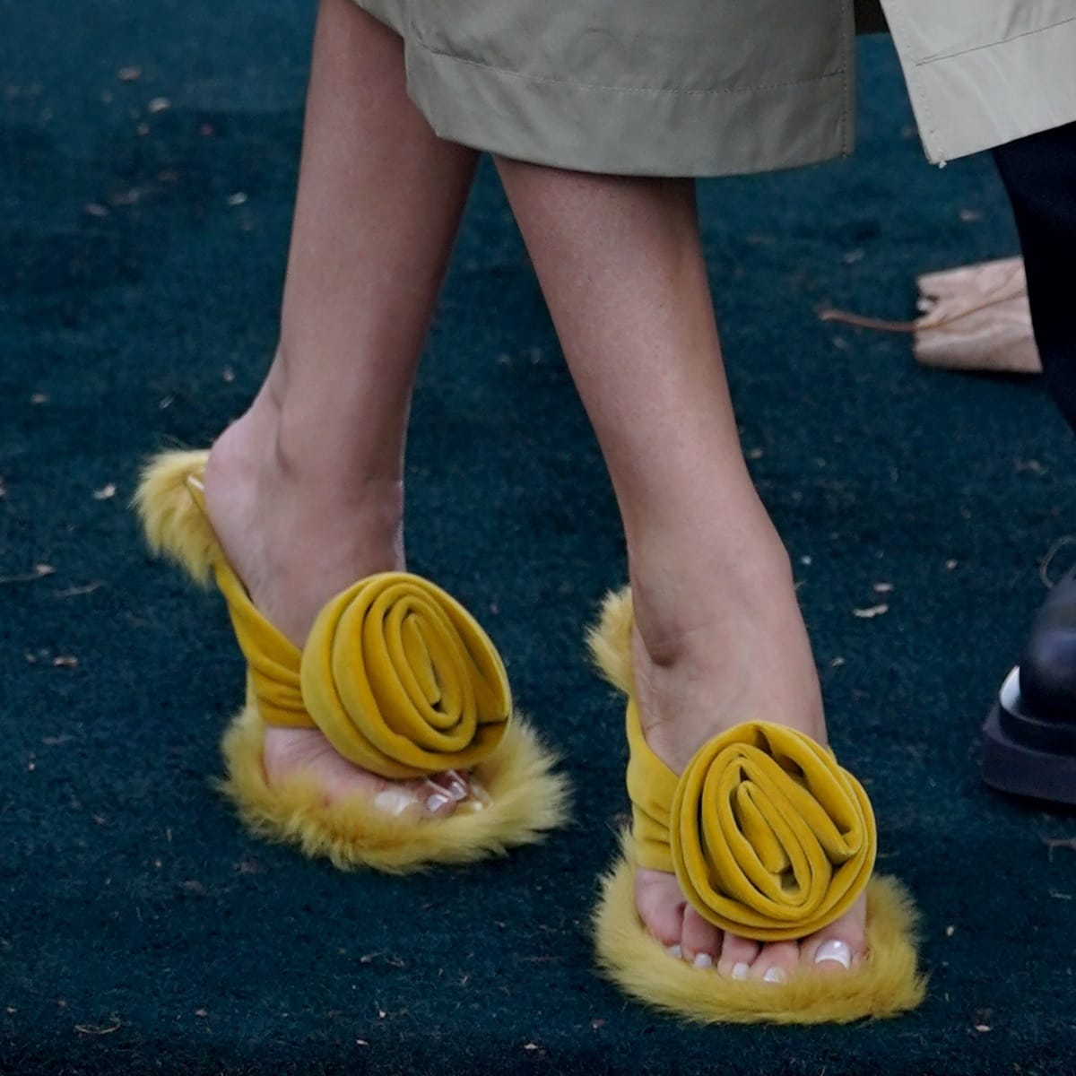 Rosie Huntington-Whiteley flaunts her fresh pedicure while wearing striking lemon yellow Burberry Rose 100mm shearling velvet sandals