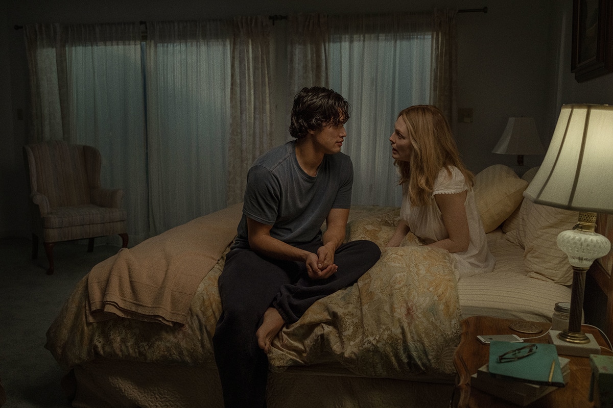 In a delicate white nightgown, Julianne Moore shares an intense scene with Charles Melton in May December, a drama loosely inspired by the real-life Mary Kay Letourneau case