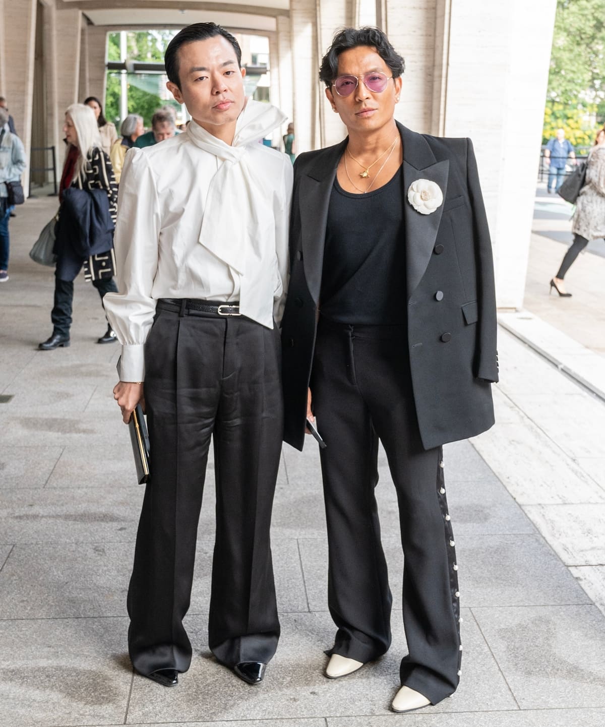 Ezra J. William wore a white bow-tie blouse with wide-leg trousers and glossy black shoes, while Prabal Gurung opted for a black double-breasted suit with pearl-trimmed pants and cream pointed-toe boots at the American Ballet Theatre's June Gala and premiere of “Like Water For Chocolate” at The Metropolitan Opera House in New York on June 22, 2023