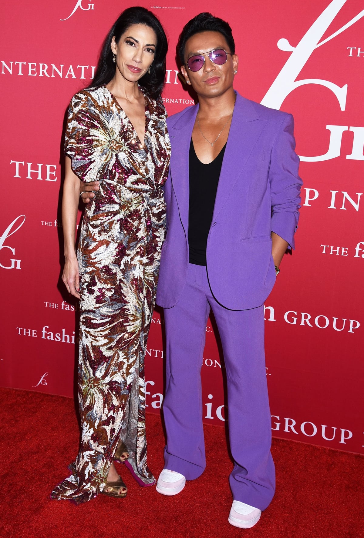 Huma Abedin dazzled in a sequined floral gown with metallic heels while Prabal Gurung stood out in a bold purple suit and white sneakers at the FGI 38th Annual Night of Stars Gala at Cipriani South Street on October 13, 2022, in New York City
