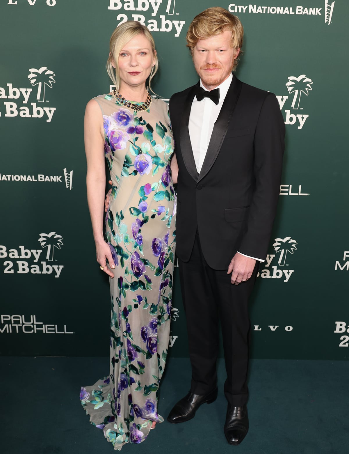 Kirsten Dunst and husband Jesse Plemons make a sophisticated pair at the 2023 Baby2Baby Gala, with Kirsten dazzling in a floral Dries Van Noten gown beside Jesse’s classic tuxedo look