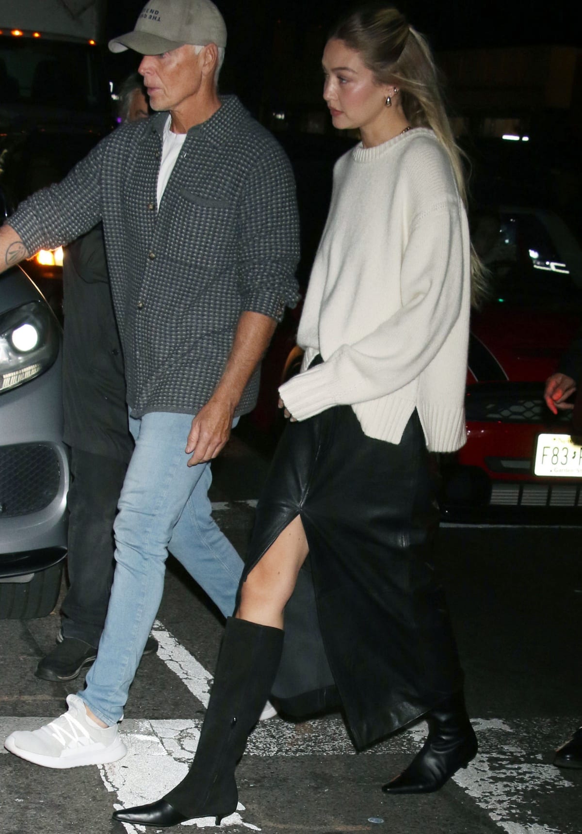 Gigi Hadid finished off her chic look with gold jewelry and Toteme slim mixed leather knee-high boots