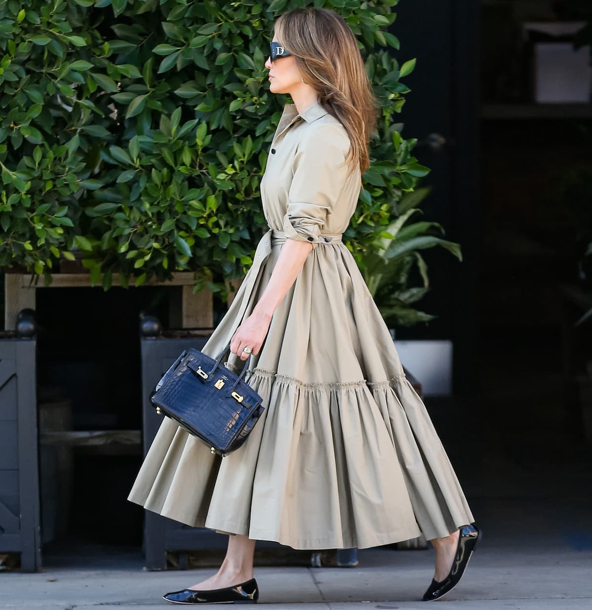 Jennifer Lopez carrying a black crocodile Hermes Birkin bag to house her essentials and wearing Dsquared sunglasses to shield her eyes from the sun