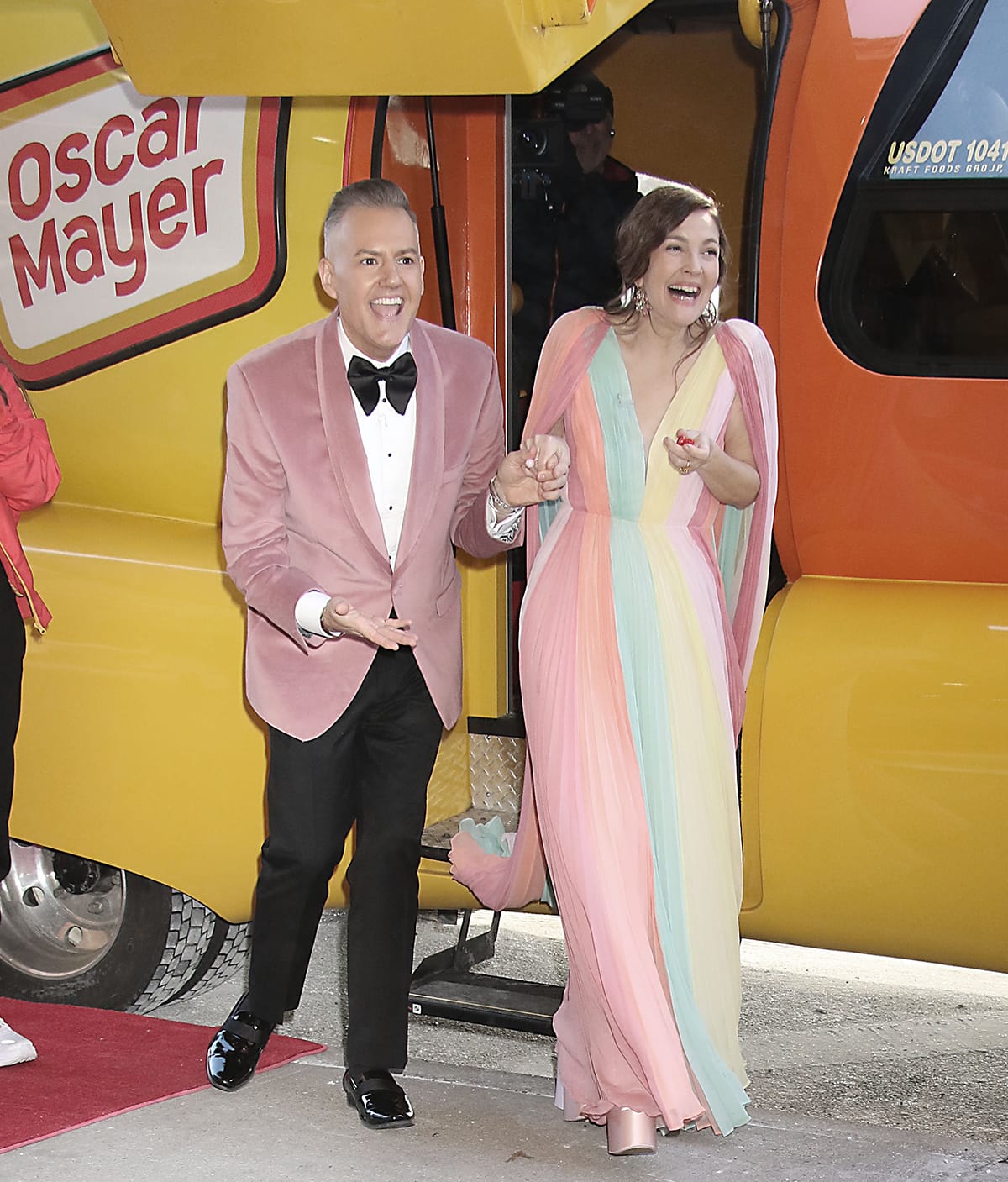 Ross Mathews and Drew Barrymore beam with joy as they step out of the Oscar Mayer Wienermobile in New York City during her 49th birthday celebration on February 20, 2024