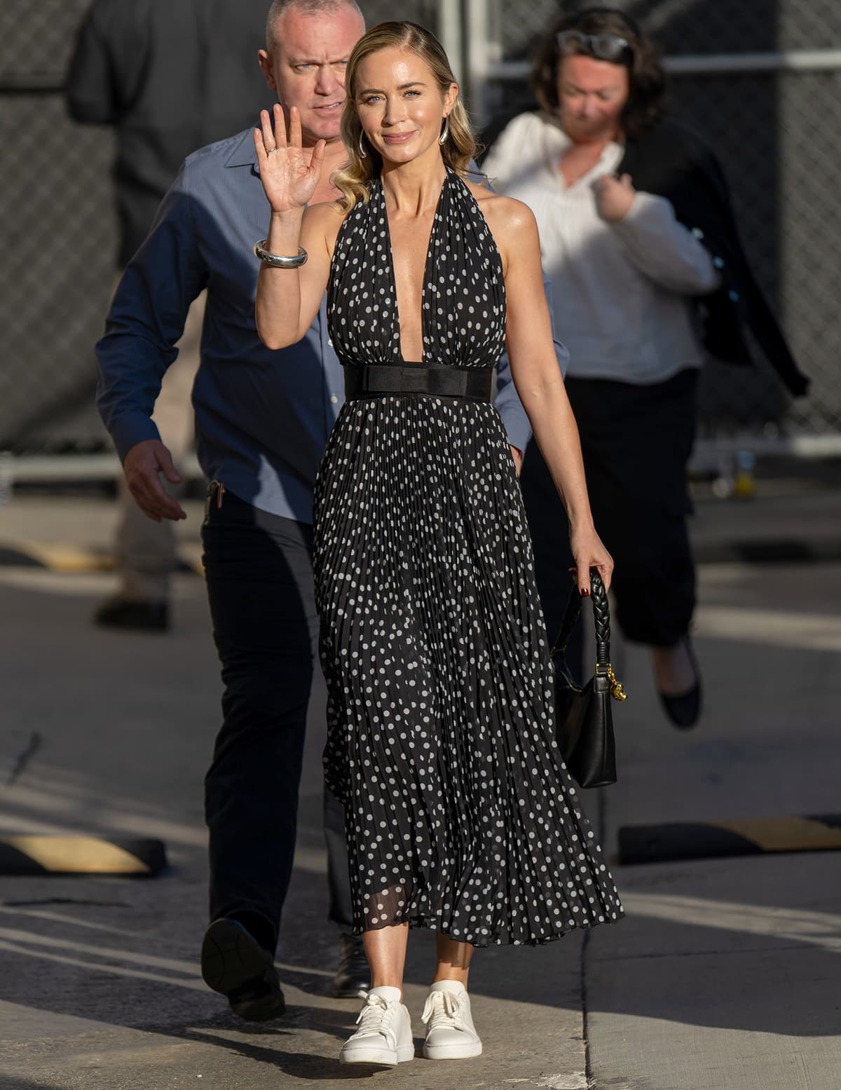 Emily Blunt wows in a plunging polka-dot dress by Dolce Gabbana ahead of her appearance on Jimmy Kimmel Live on February 23, 2024