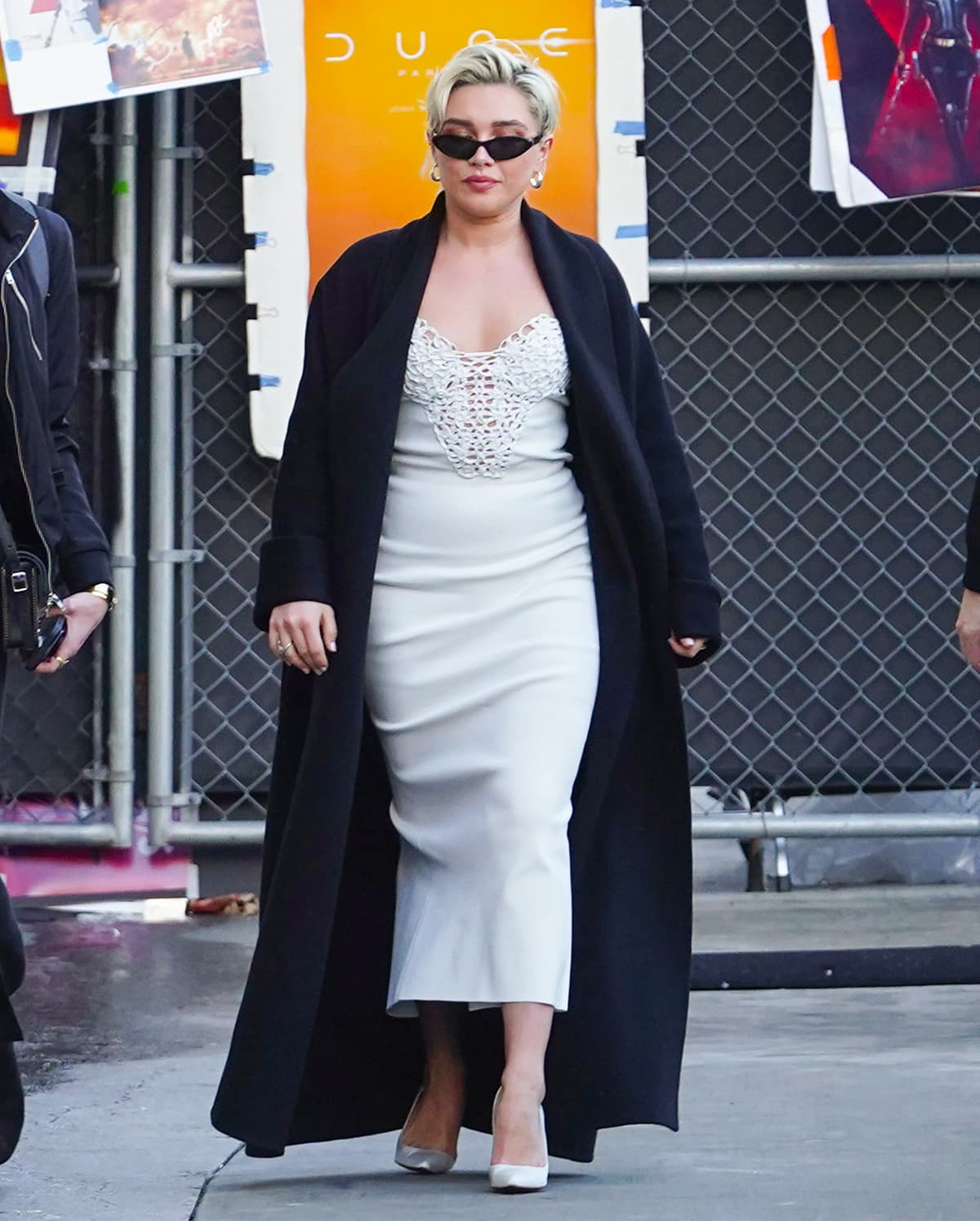 Florence Pugh steps into Jimmy Kimmel Live! wearing a white Galvan midi dress anchored by crisp white Christian Louboutin So Kate pumps that sharpen the entire look