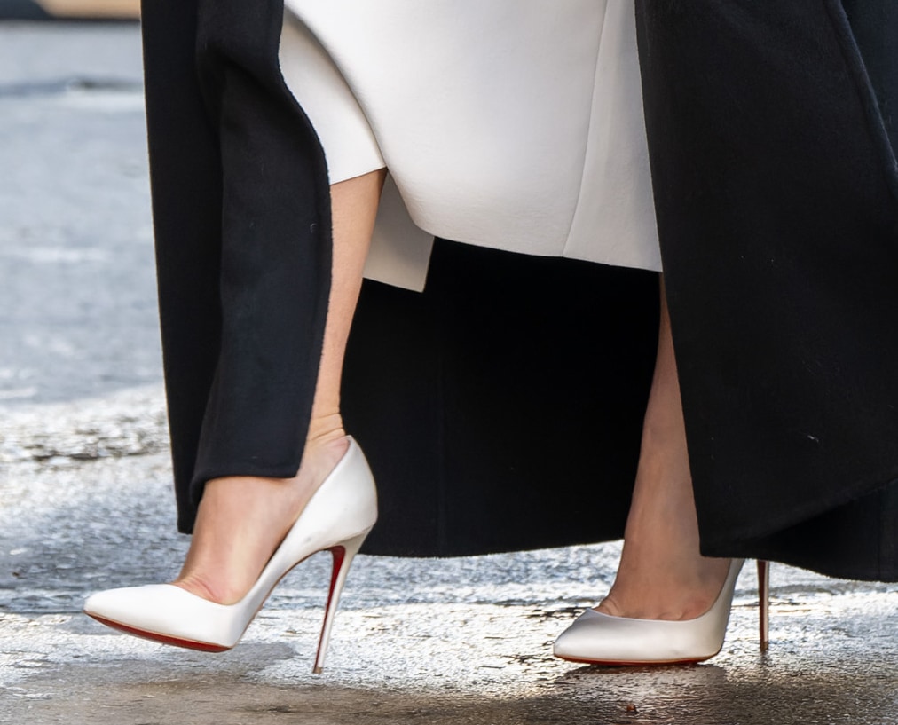 Florence Pugh elevates her look with white Christian Louboutin So Kate pumps, featuring razor-sharp pointed toes and sky-high stiletto heels that create a clean, leg-lengthening line