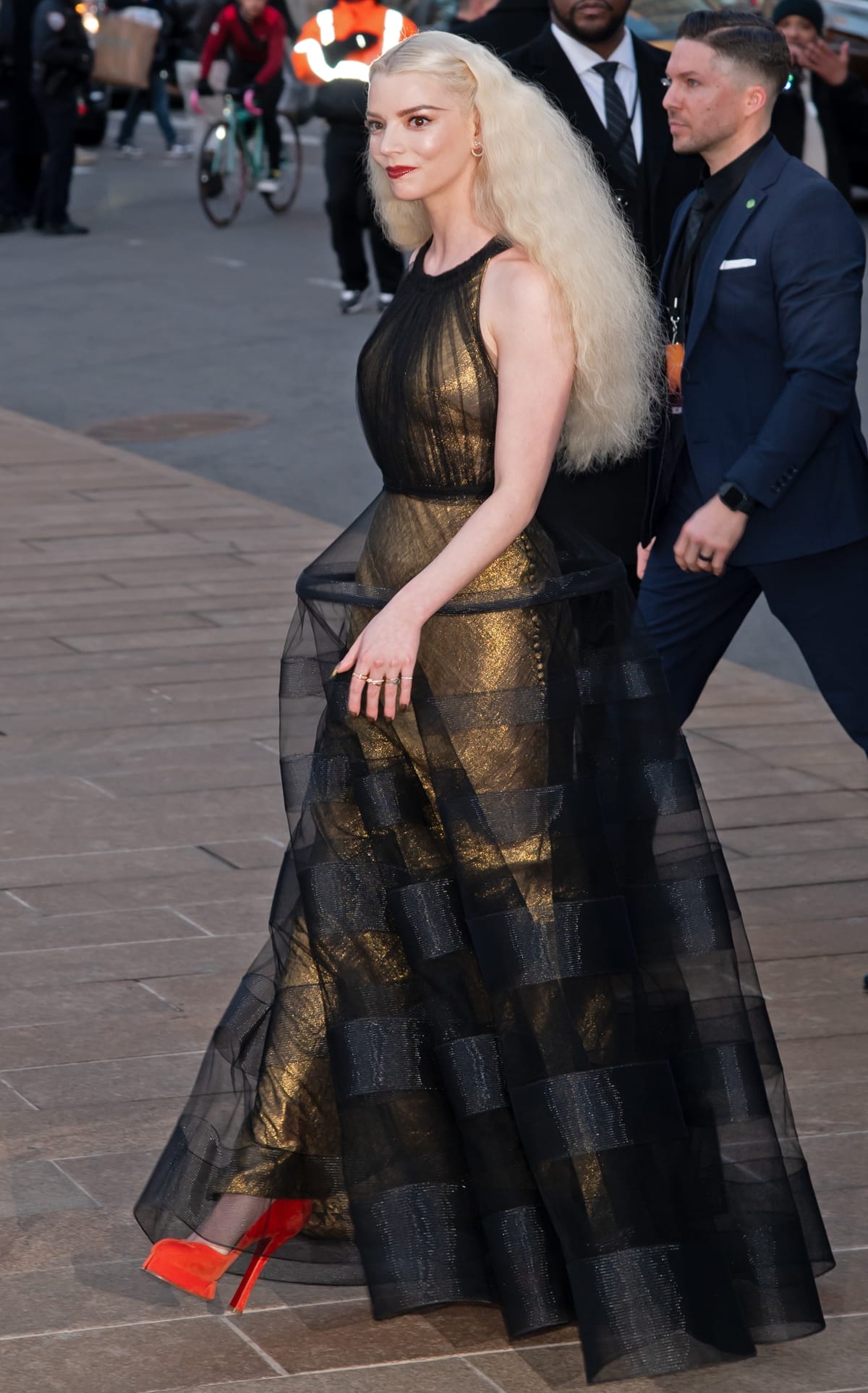 Paired with red velvet and leather Christian Louboutin Tabi pumps and minimalistic Tiffany Co. jewelry, Anya Taylor-Joy's look is a perfect mix of bold and intricate, highlighting her unique fashion sense and leaving a lasting impression on the premiere's red carpet