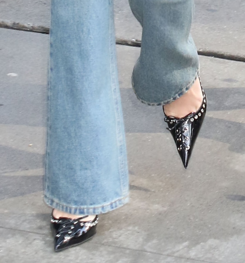 Sydney Sweeney completes her denim look with black Mach Mach lace-up corset shoes