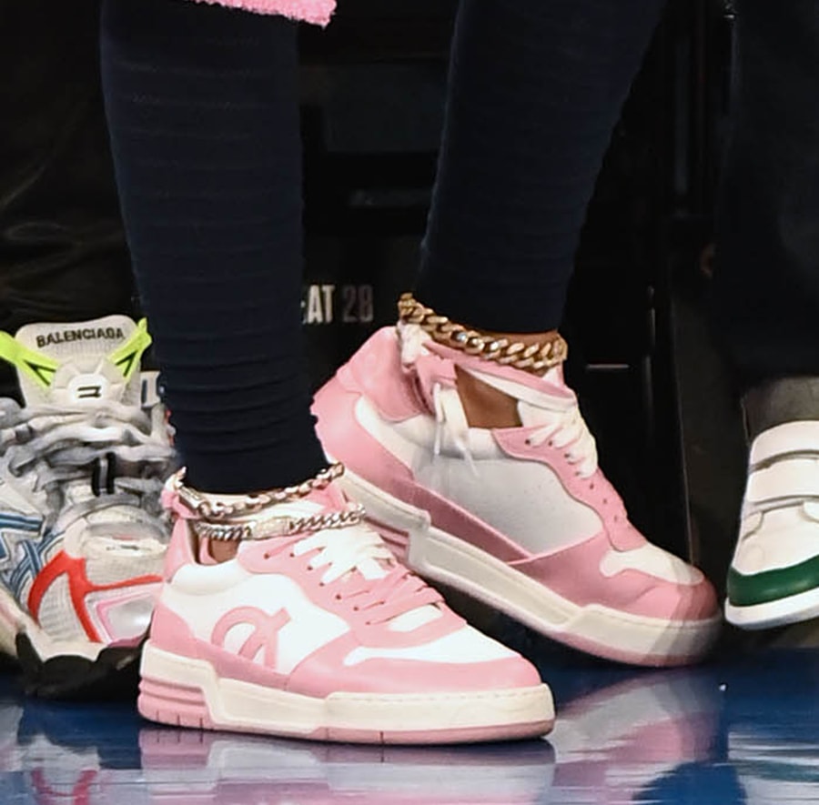 Nicki Minaj wears white-and-pink sneakers from her shoe collection with British vegan sneakers and apparel label Loci