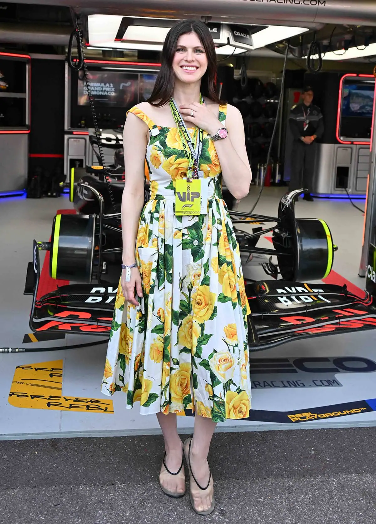 Alexandra Daddario stands out in a pretty white and yellow floral midi dress by Dolce Gabbana at the Monaco F1 Grand Prix