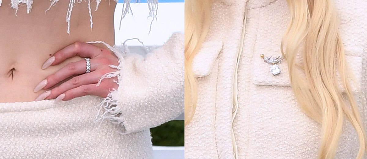 Anya Taylor-Joy styles her creamy bouclé knit ensemble with Tiffany Co. Schlumberger Bird on a Rock diamond brooch and a couple of diamond rings