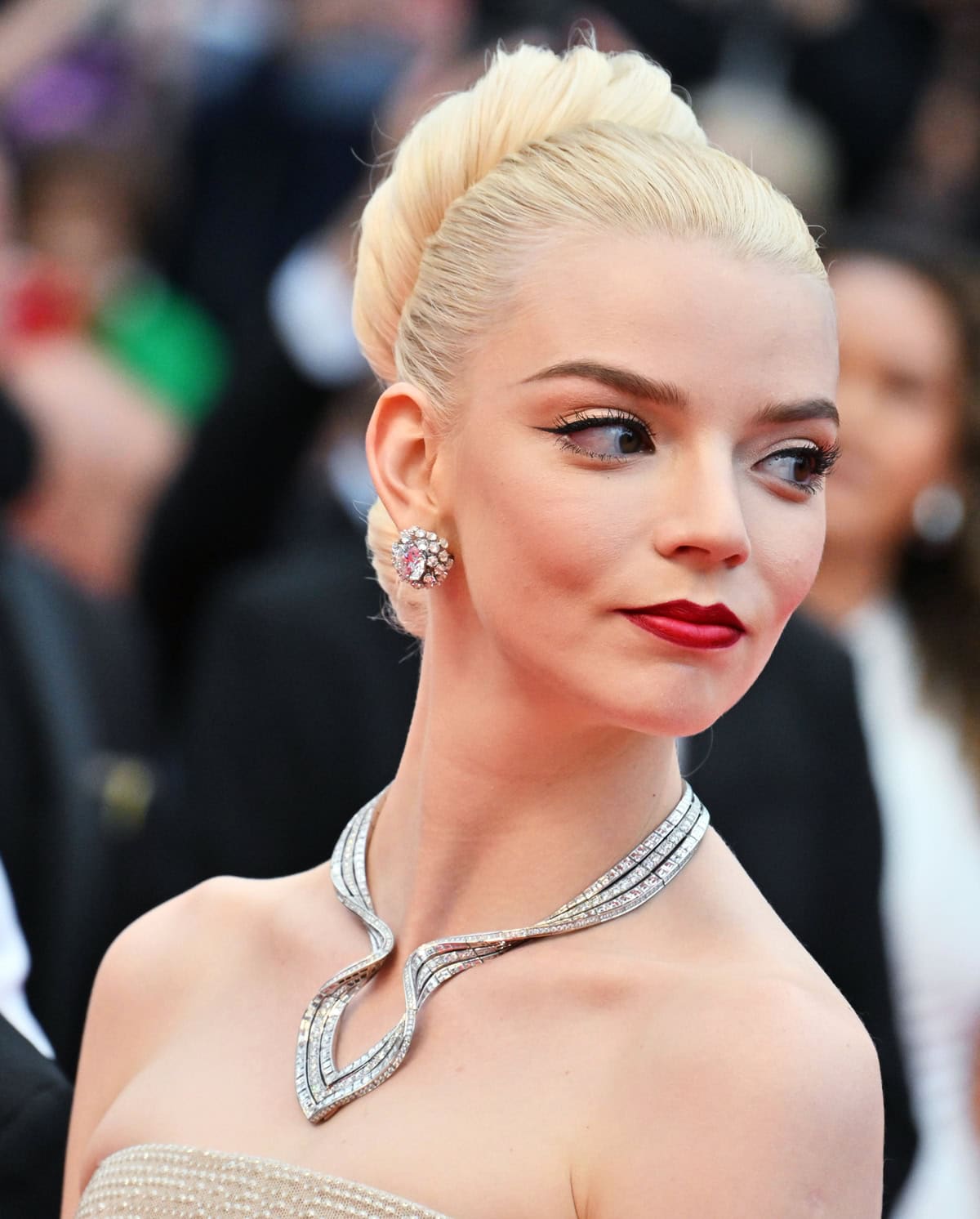 Anya Taylor-Joy's red carpet look was elevated by layers of Tiffany Co. jewelry, including a dazzling diamond statement necklace and elegant platinum rings styled by Ryan Hastings