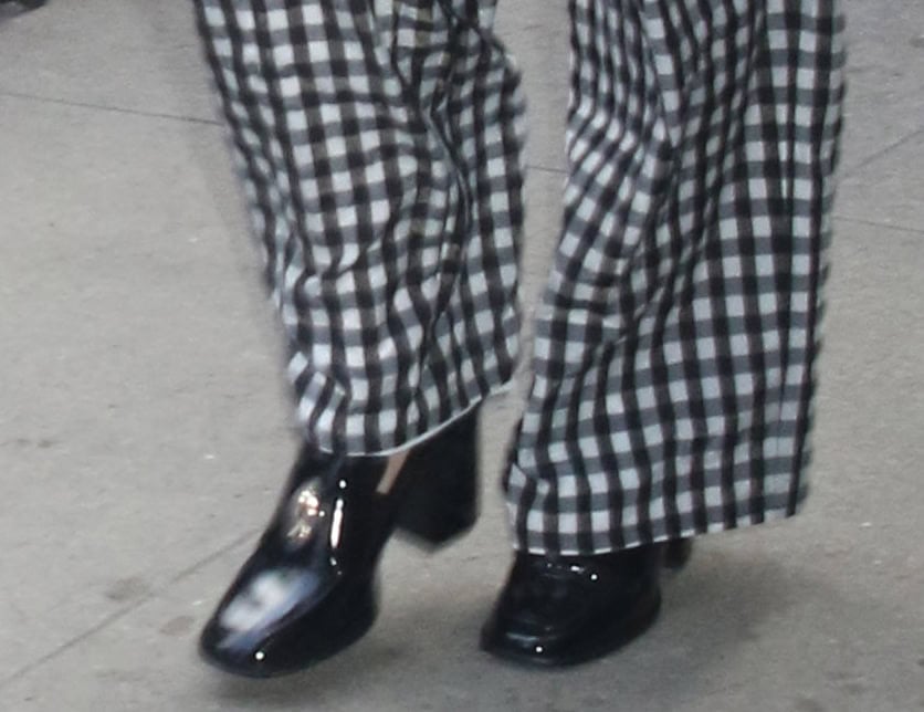 Daisy Ridley teams her black-and-white gingham ensemble with chunky black patent loafers by Nomasei