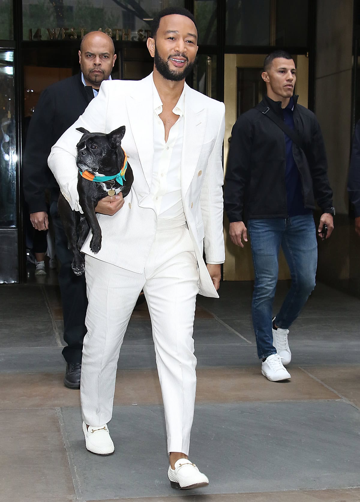 John Legend looks neat in an all-white corduroy suit with textured loafers