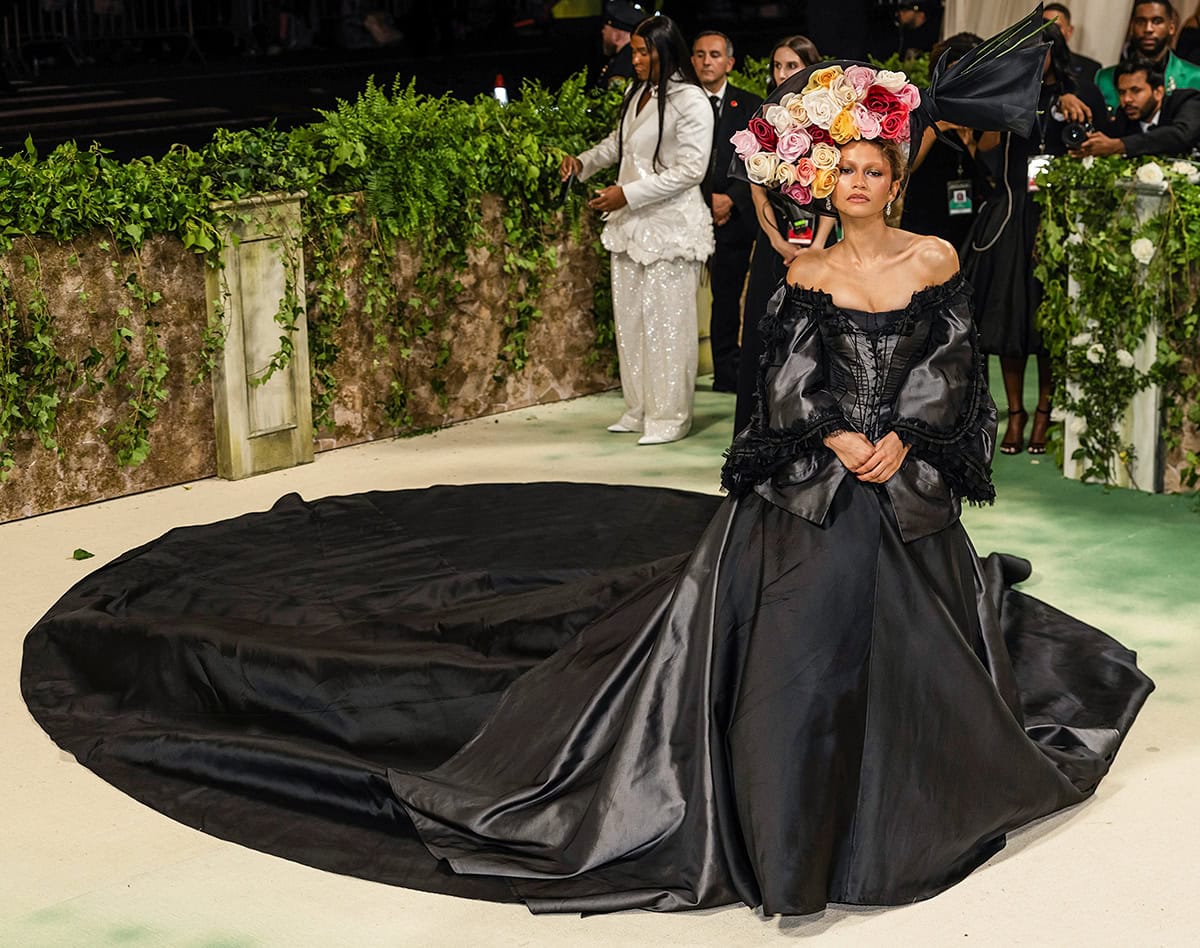 Zendaya reappears on the Met Gala steps in a voluminous black gown created by John Galliano for Givenchy's Spring 1996 Couture collection