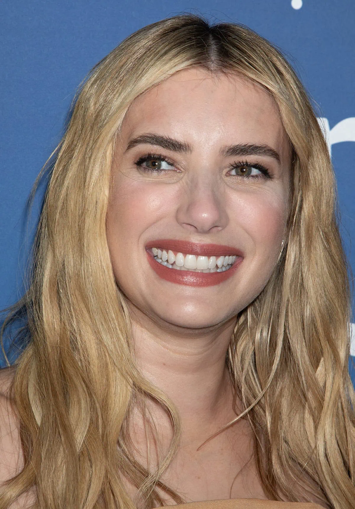 Emma Roberts shines with soft, smokey eyes that complement her greenish-brown eye color