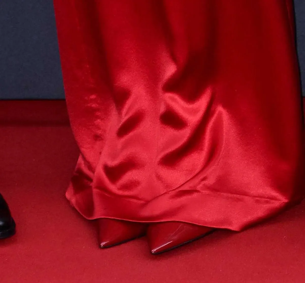 Zoë Kravitz completes her monochromatic red look with red Saint Laurent Zoe slingback pumps