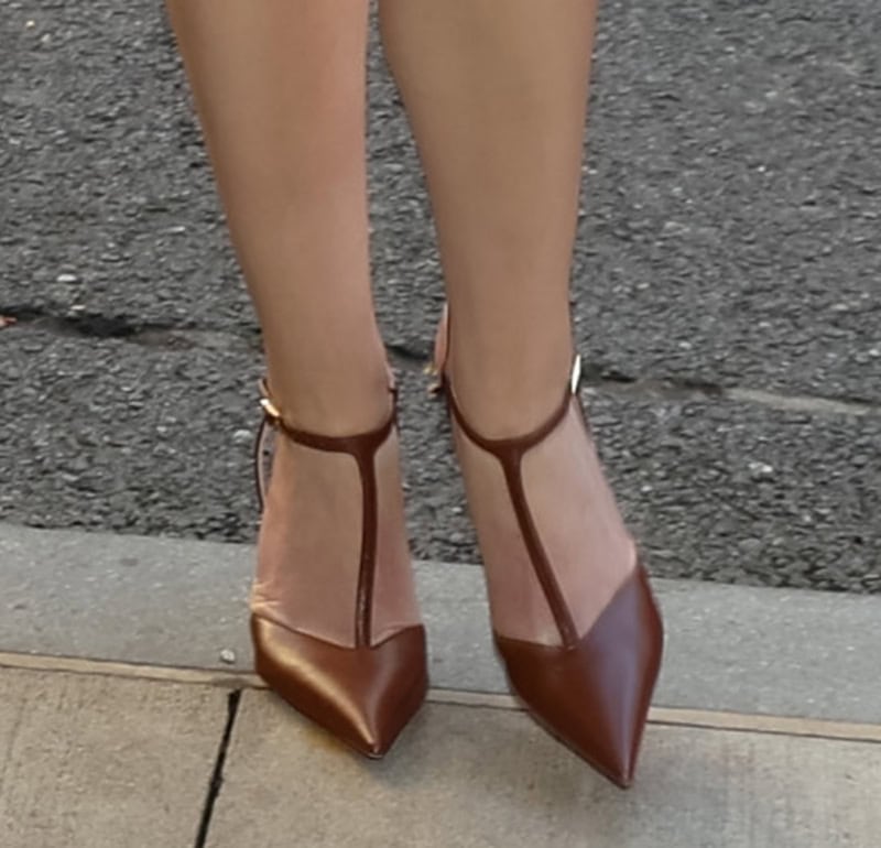 Anna Kendrick teams her sexy businesswear with brown T-strap pumps