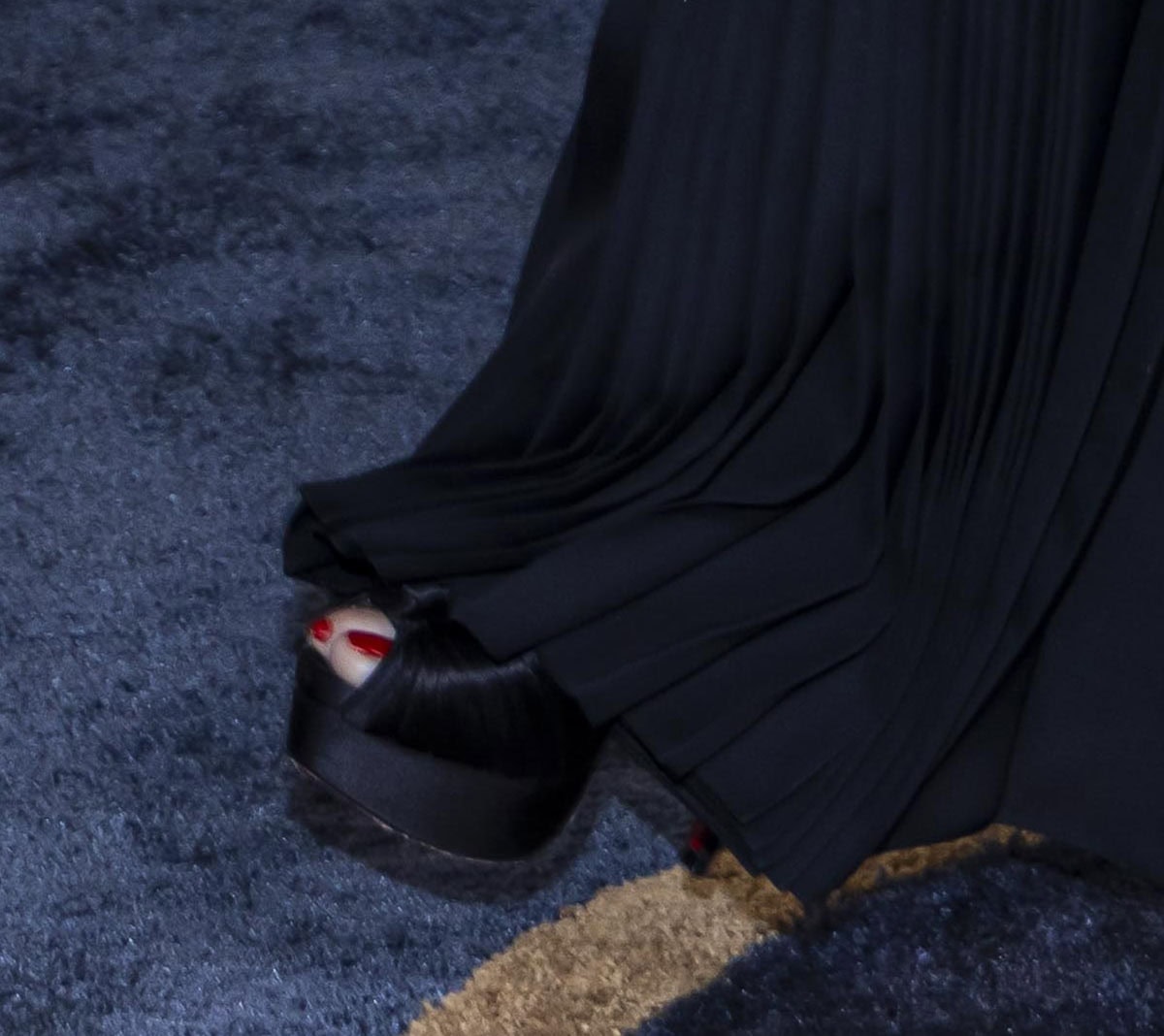 Demi Moore pairs her innovative black dress with Christian Louboutin's Marchavekel knotted pumps