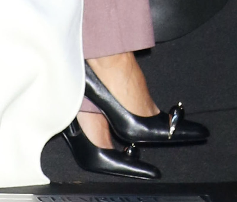 Eva Longoria opts for classic black pumps by Tory Burch, with silver metal hardware and curved heels giving them a modern twist