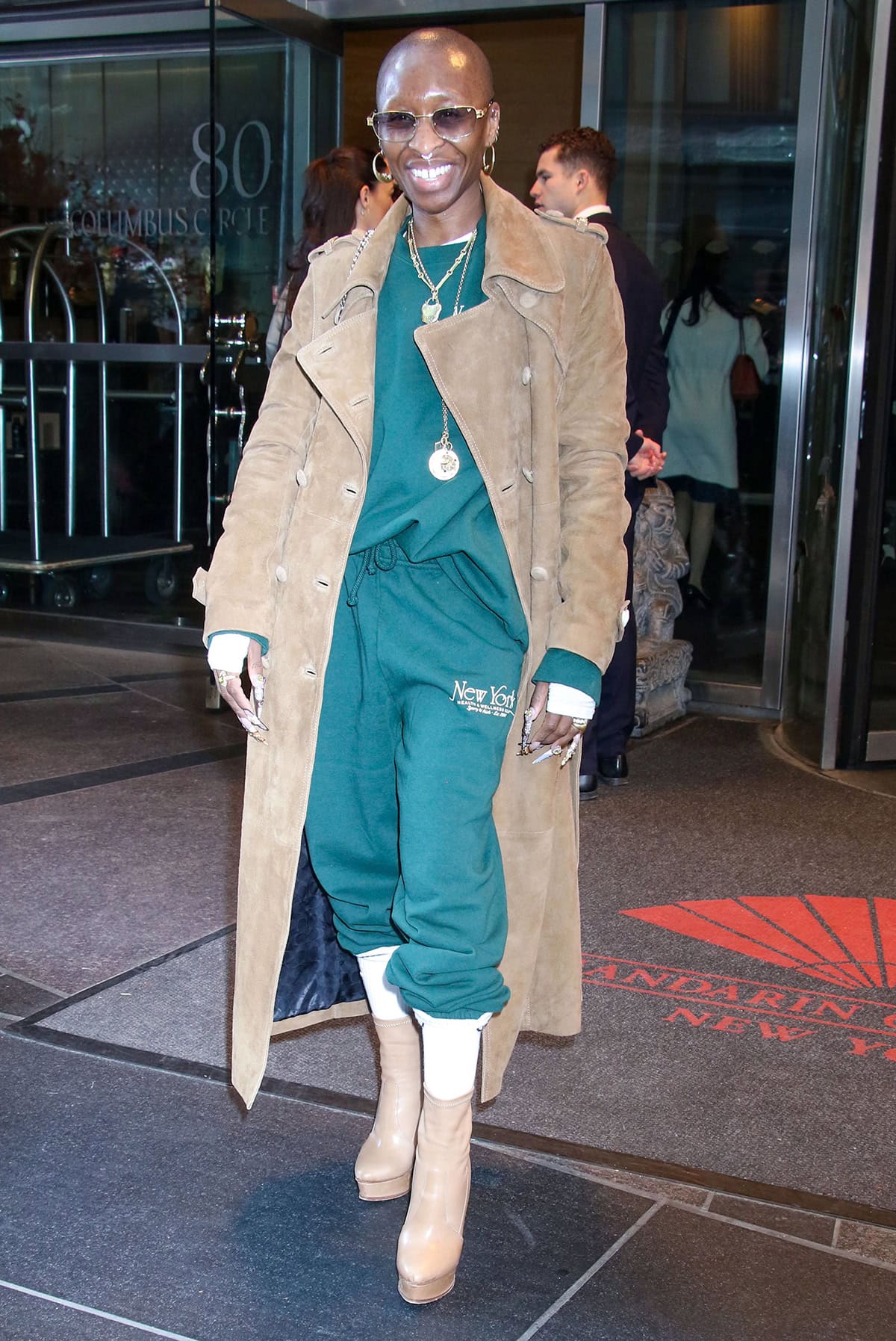 Cynthia Erivo wears a green Sporty Rich sweatsuit with retro athletic styling elements, including a New York Health and Wellness Club logo embroidery