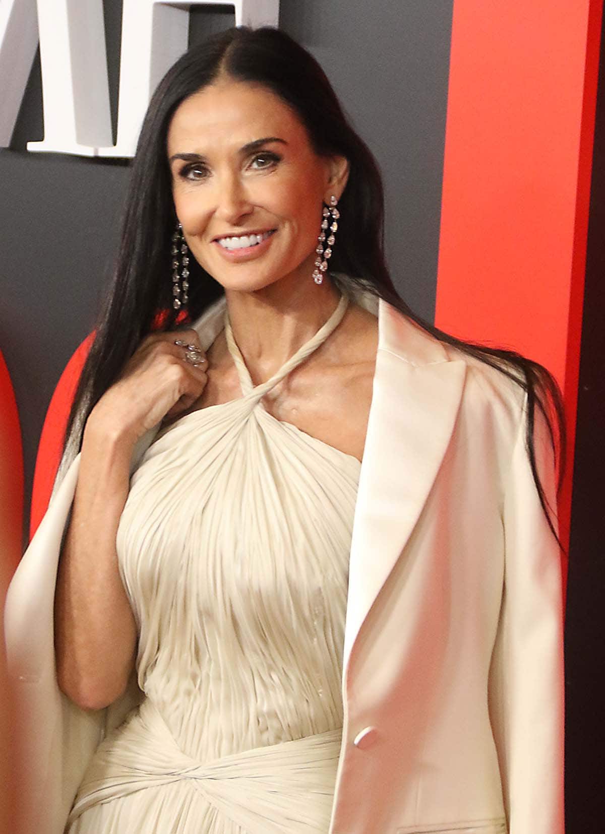 Demi Moore dazzles with opulent diamonds by Shiphra, which include a pair of Pear Twin Earrings, pear-shaped rings, and a bangle