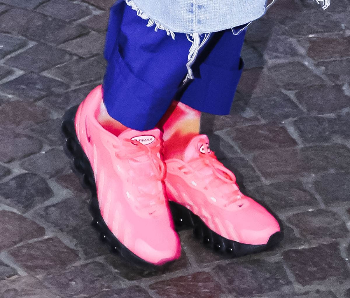 Rita Ora wears the newly released Nike Air Max DN8 Sneakers in the Hyper Pink colorway featuring a mesh upper and Nike’s full-length Dynamic Air system with eight pressurized Air tubes at the soles