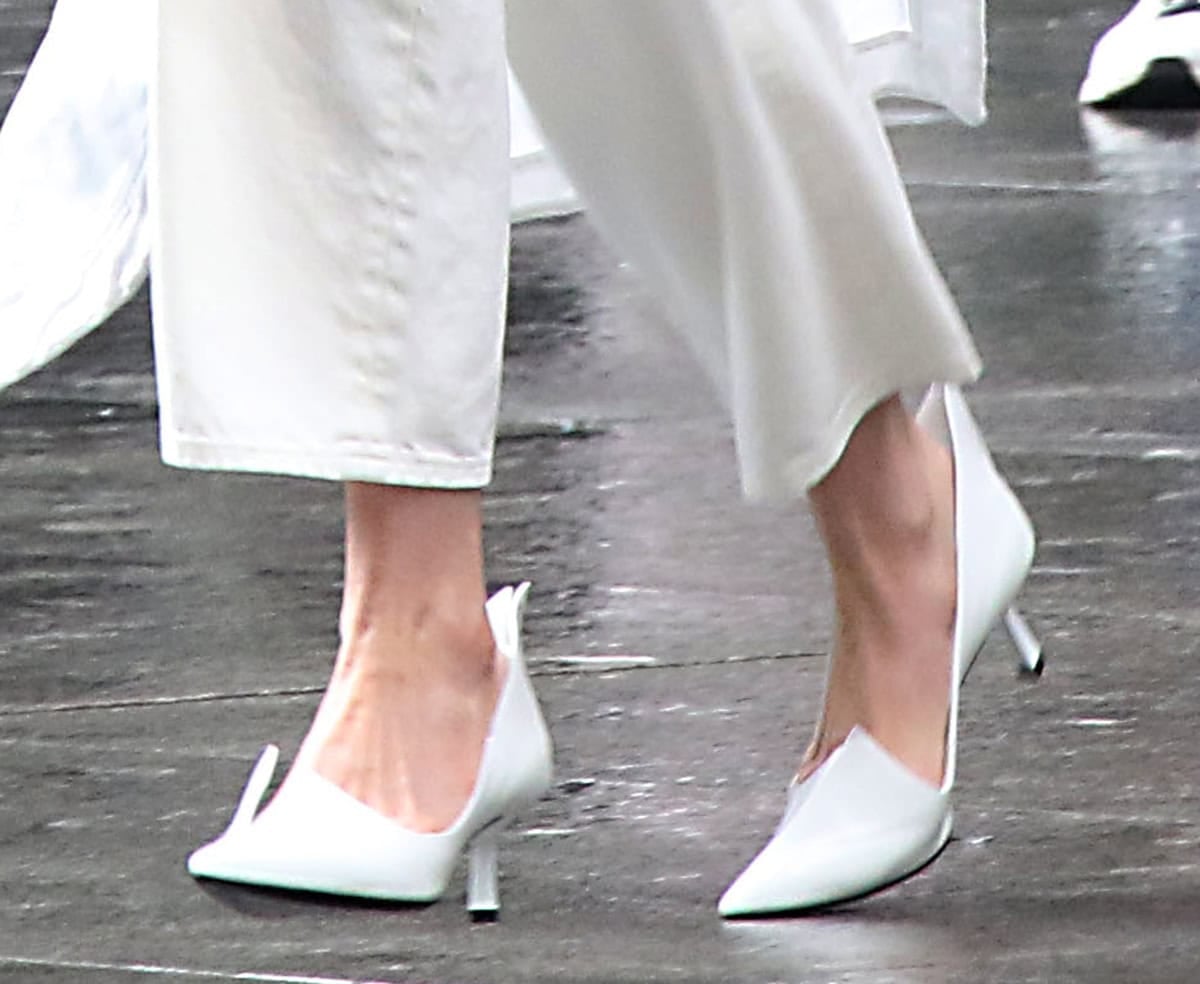 Anne Hathaway channels modern chic in architectural Prada Modellerie spiked leather pumps