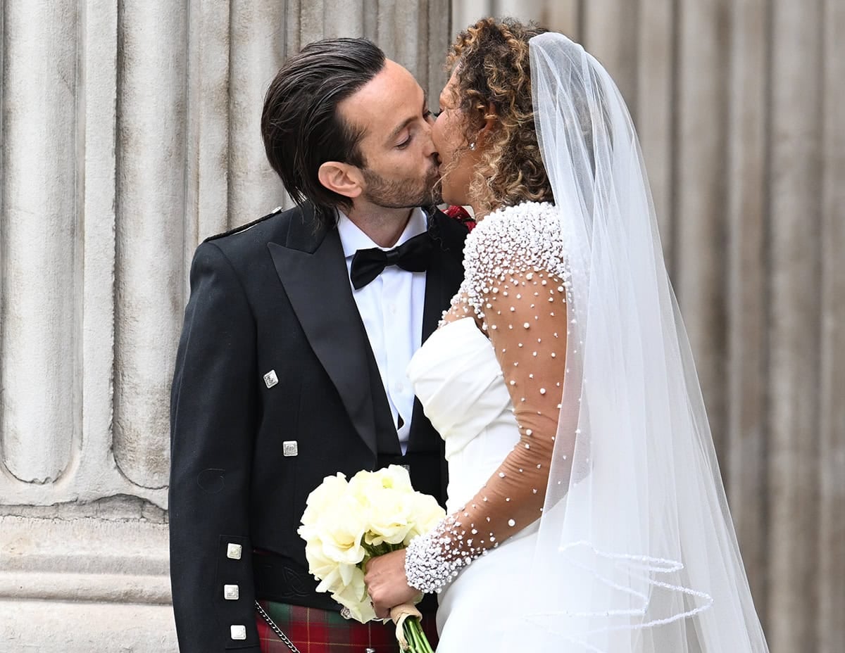 Rory McPhee and Mel B share a kiss after their wedding ceremony at St. Paul's Cathedral in London