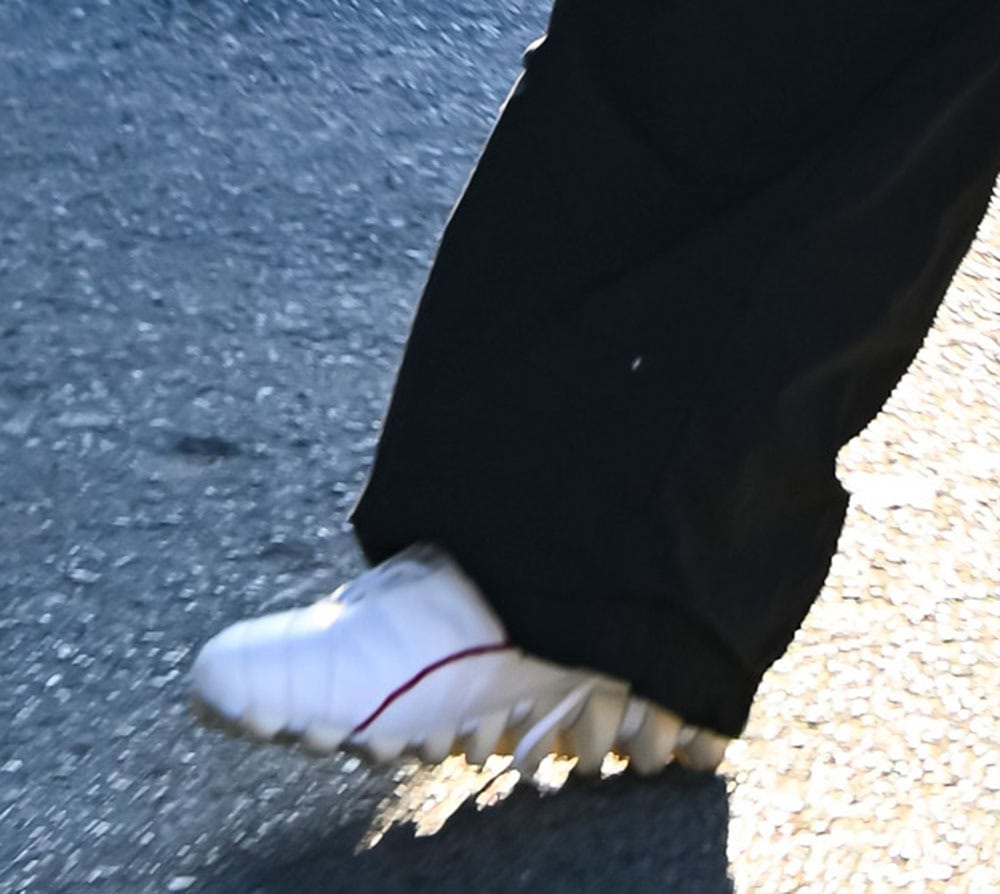 Rihanna grounds her playful balletcore-inspired look with rare Puma by Jil Sander 2002 spike sneakers, blending high-fashion whimsy with archival streetwear edge