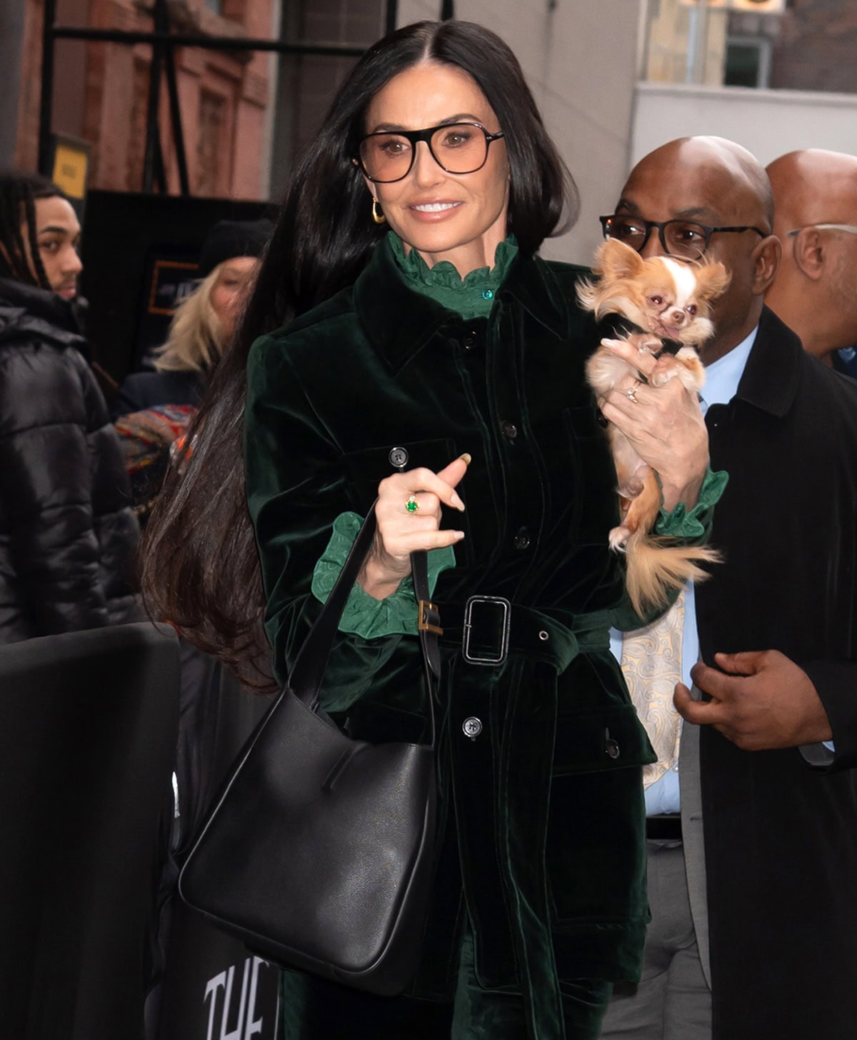 Demi Moore adds her signature polish to fall dressing, carrying a sleek Saint Laurent Le 5 à 7 bag and her beloved Chihuahua, Pilaf, while stepping out in forest-green velvet