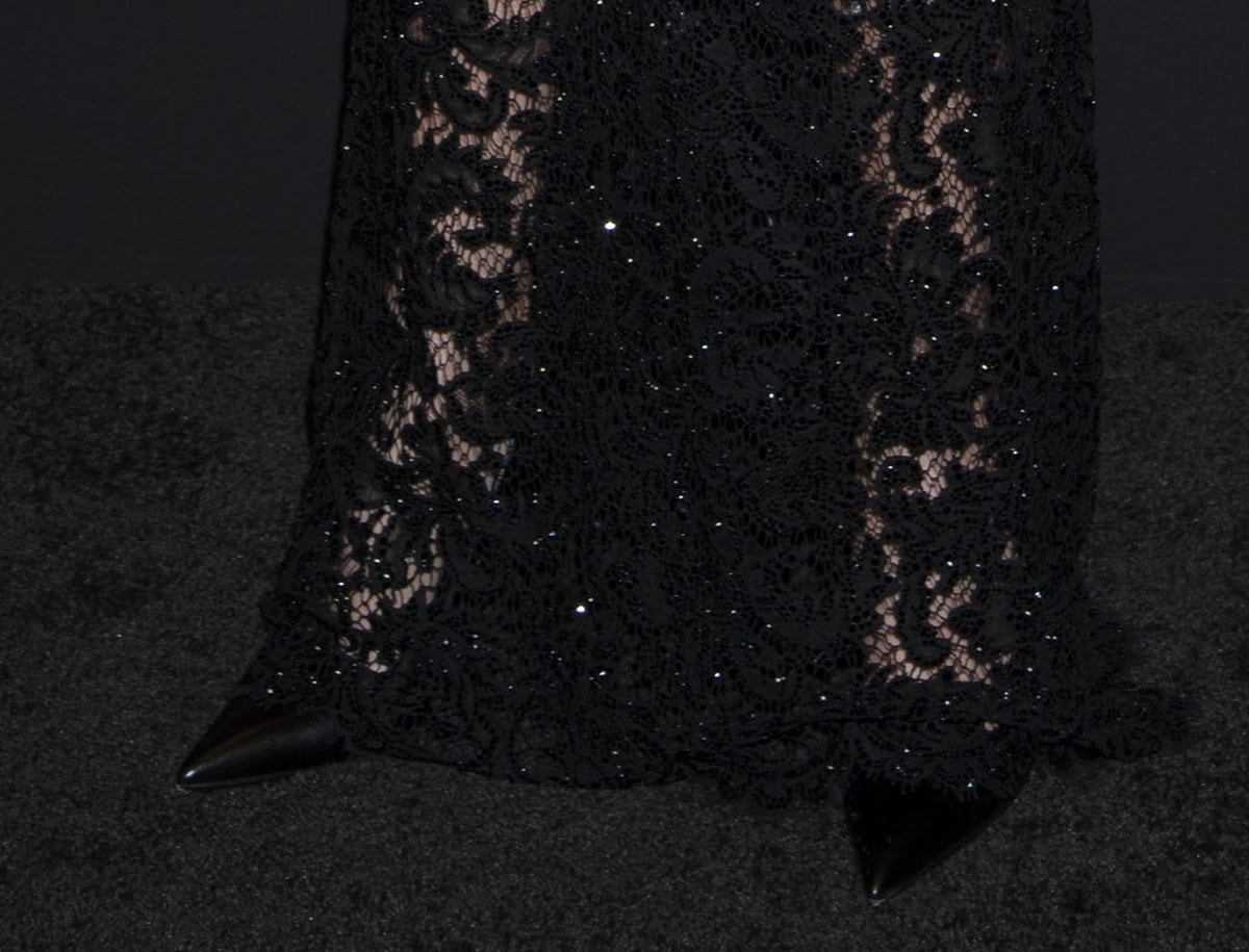 Demi Moore opts to keep her footwear simple, pairing her elaborate lace dress with classic black pointy pumps