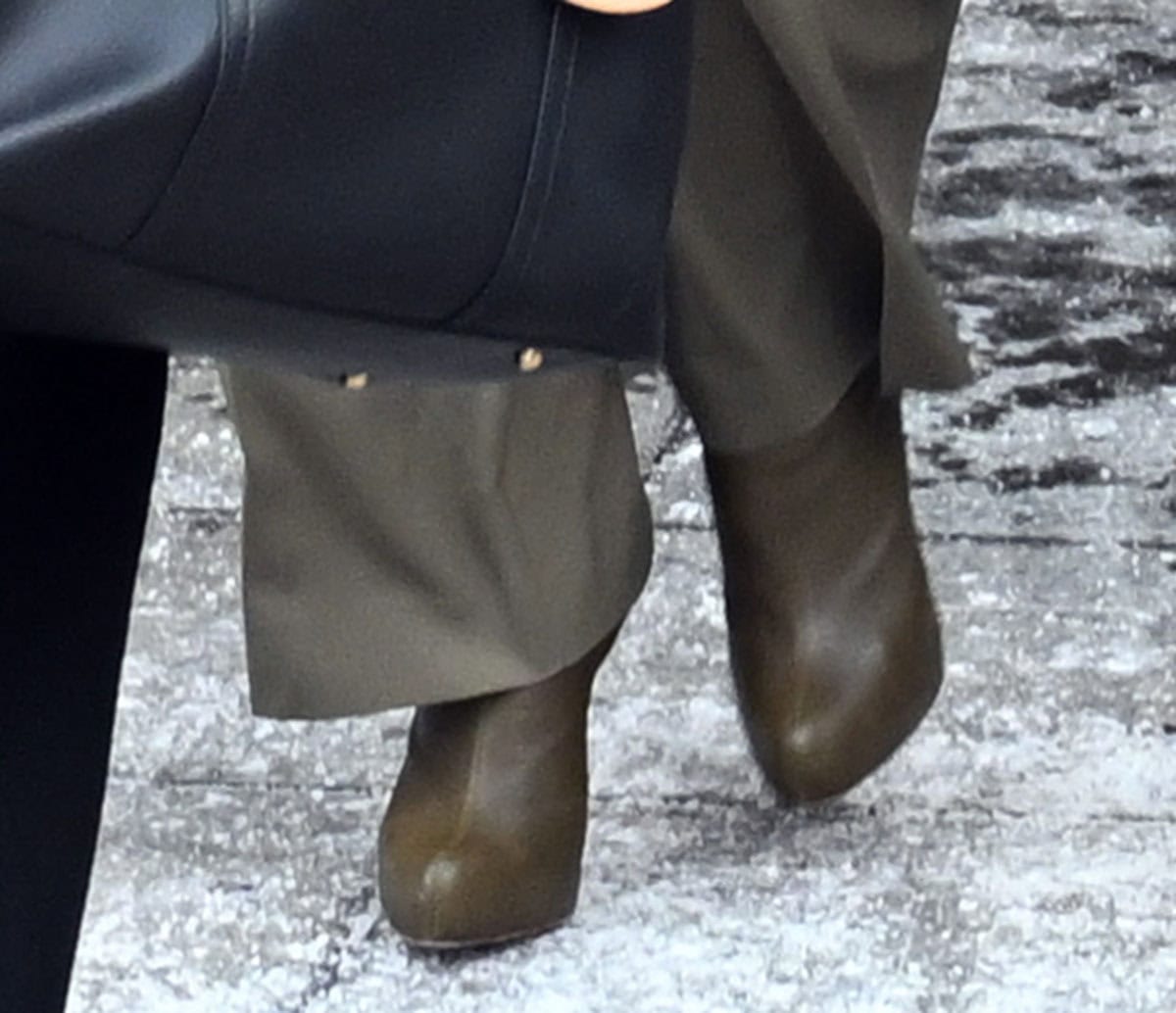 Blake Lively slips into a pair of olive green Christian Louboutin “Ariella Talon” 120 boots featuring platforms and wooden heels