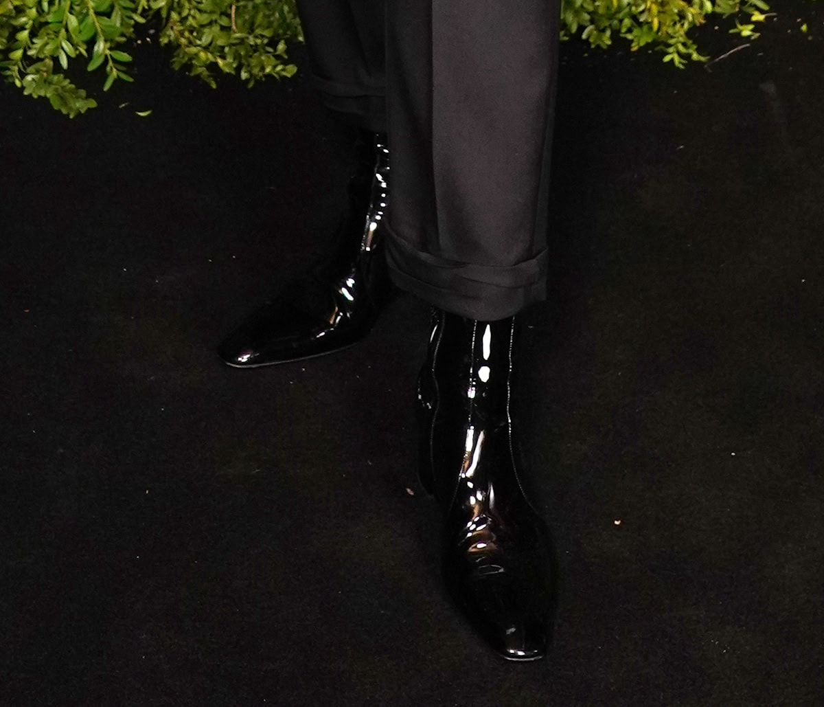 Gwendoline Christie completes her cool and edgy black-and-white look with glossy ankle boots
