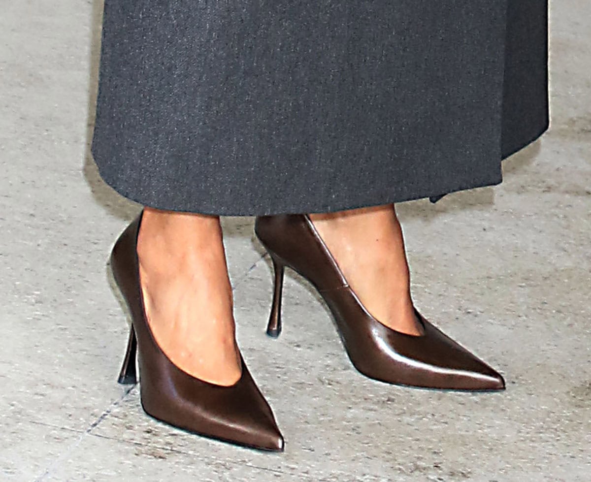 Halle Berry completes her understated winter ensemble with brown leather pointy pumps