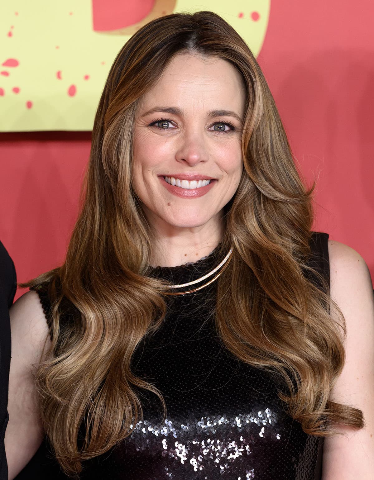 Rachel McAdams styles her already shimmering outfit with Tiffany Co. necklace, earrings, and rings