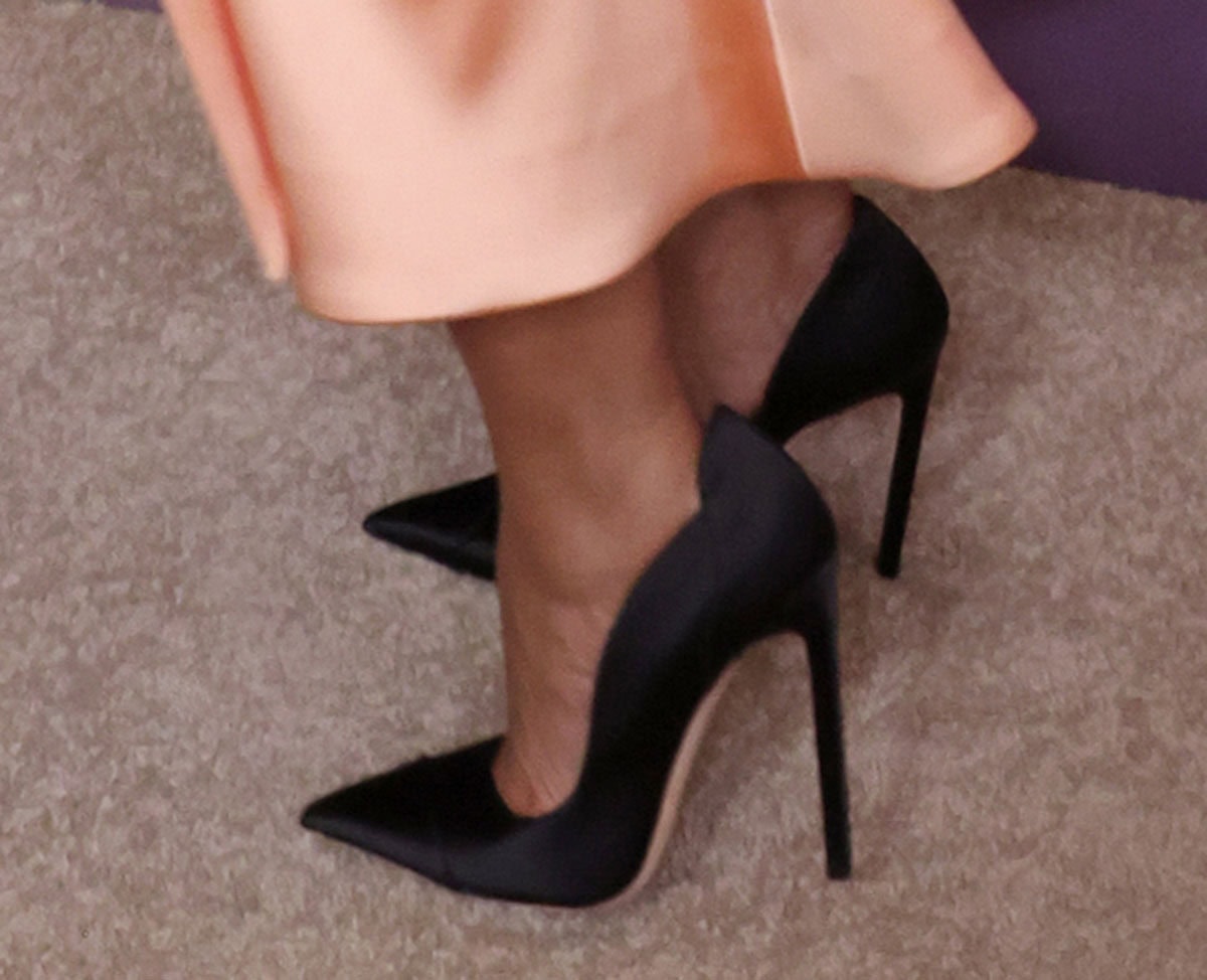 Tracee Ellis Ross teams her peach outfit with black Jimmy Choo “Brigitte” pumps