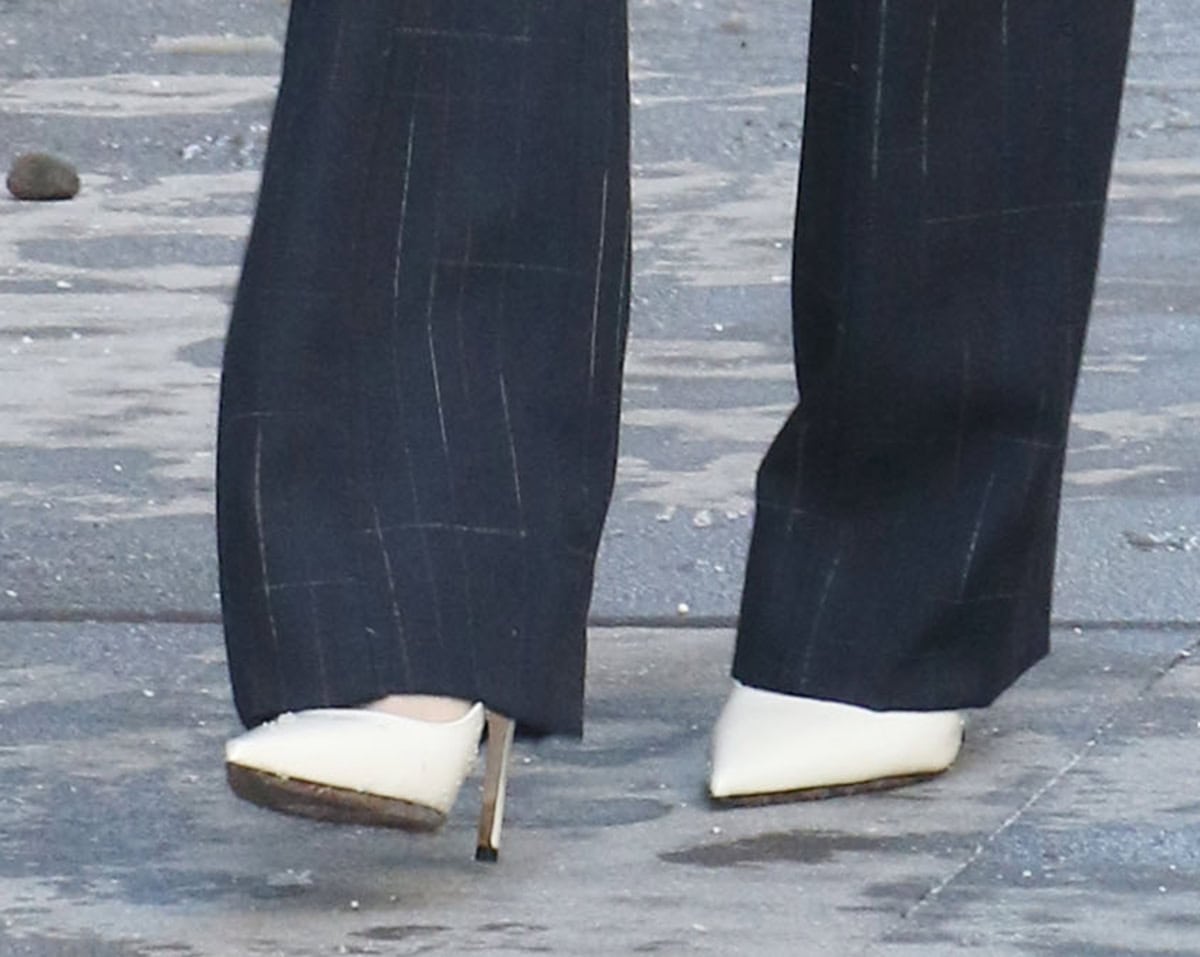 Chloe Kim teams her casual but polished ensemble with white leather slingback pumps