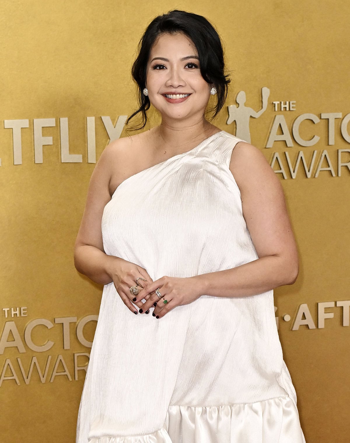 Kristin Villanueva teams her wedding-ready shoes with a white one-shoulder dress by Ouma Couture Atelier