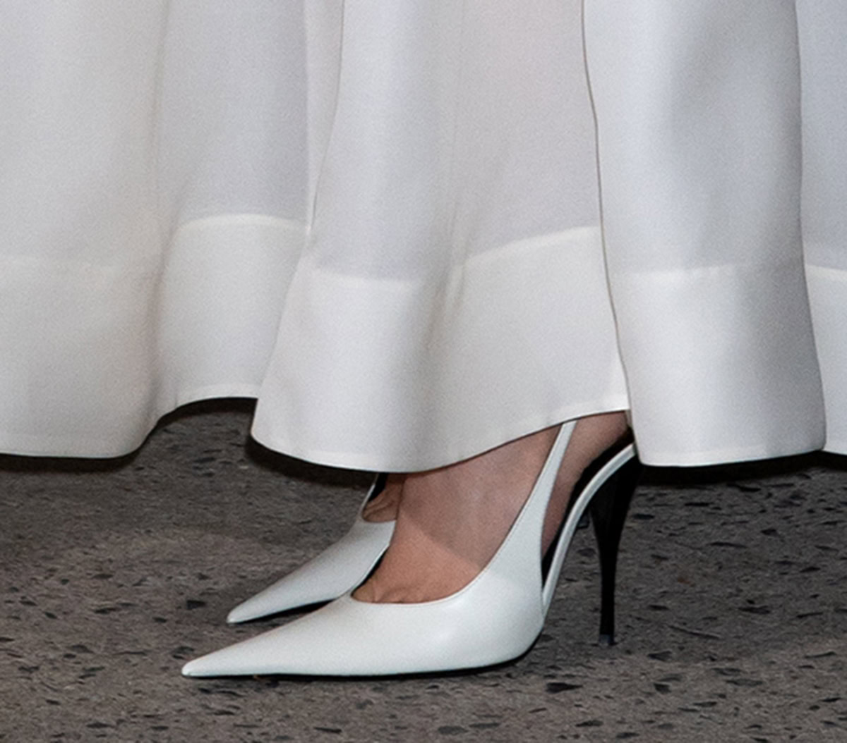 Rosé keeps it sleek in Saint Laurent P.A.R.I.S. slingback pumps featuring elongated pointed toes and lacquered metal stiletto heels