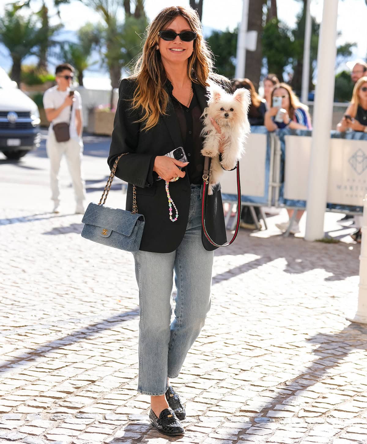 Heidi Klum embraces a chic French girl look in a black blazer, cropped jeans, and loafers ahead of the 79th annual Cannes Film Festival at Hotel Martinez