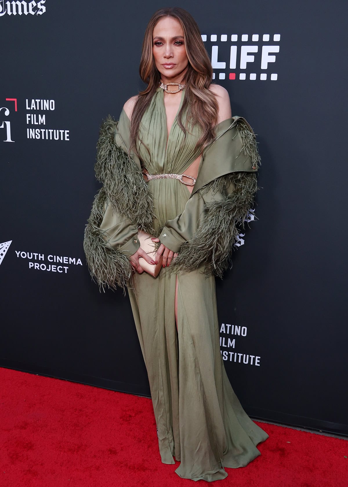Jennifer Lopez looks glamorous in her sage green Bronx Banco gown and nude satin platform heels as she's honored with the inaugural Adelante Award at the 25th Los Angeles Latino International Film Festival